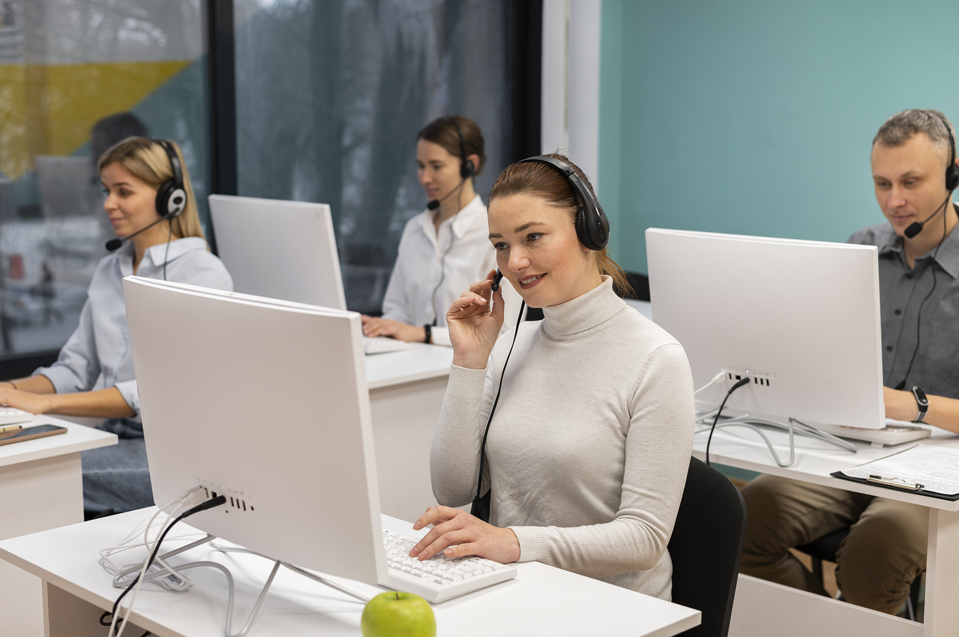 colleagues-with-headphones-working-call-center-office
